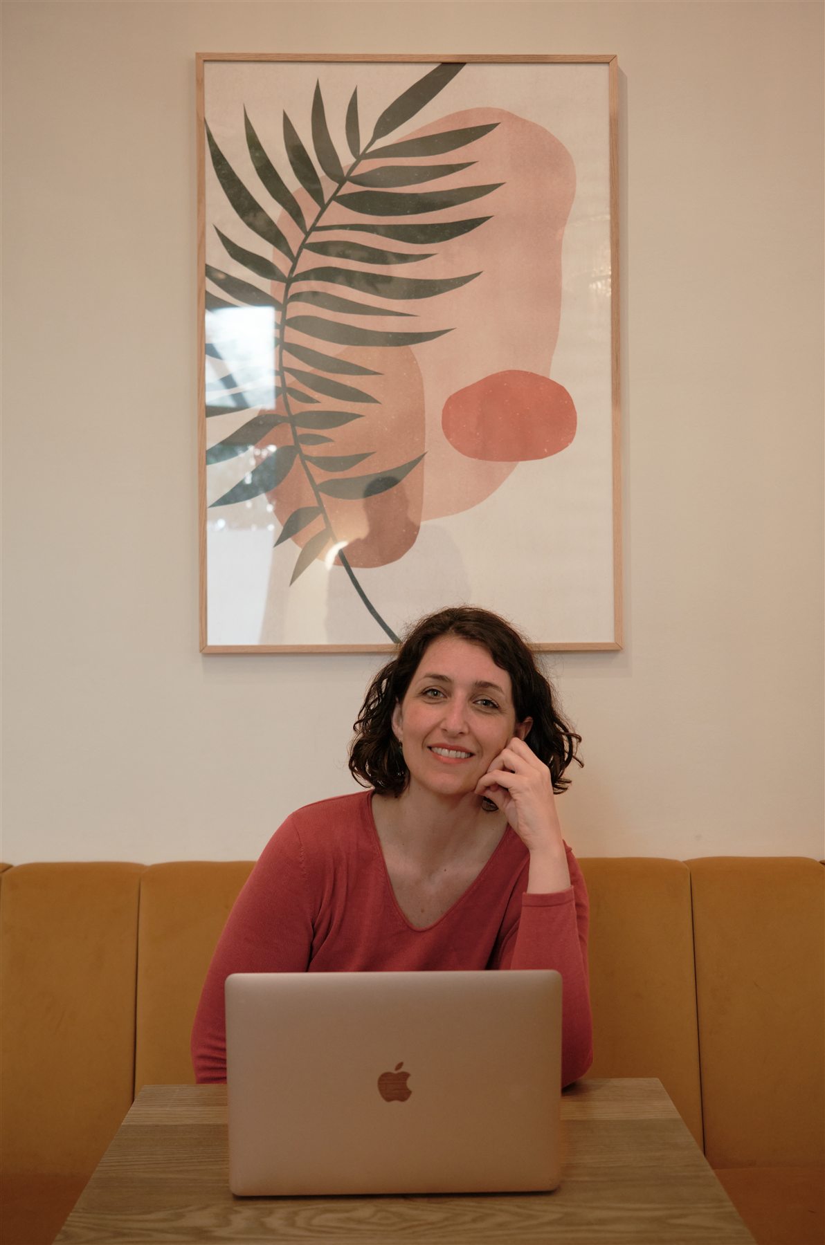 Environmental portrait of a young professional at a workspace in Berlin