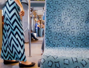 Blue patterns match between a dress and a train sit